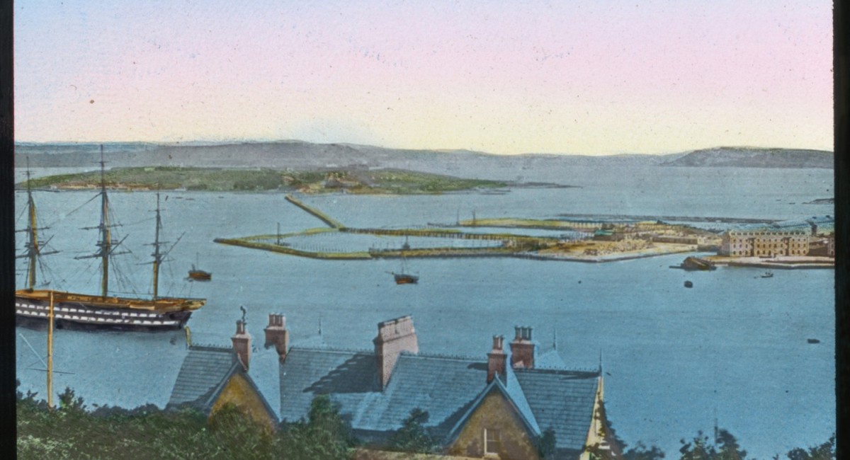 Hand-tinted, late 19th-century lantern slide of Spike and Haulbowline islands and the connecting causeway, completed in 1867 Image © courtesy of Collection of Michael Lenihan. | Spike Island: People and Place 1847 – 1883 | Friday 6 April – Sunday 1 July 2018 | SIRIUS