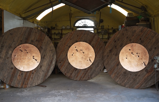 Remco De Fouw, Fire Wall, 2021, Communications Cable Reels, Copper Leaf, 250 x 250 x 8cm each, Photography Lar O’Toole, Image courtesy of the artist. | Remco De Fouw RHA: Tales of Hyperborea | Friday 11 February – Sunday 6 March 2022 | Royal Hibernian Academy