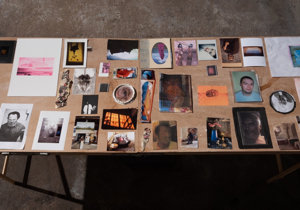 Austin Hearne: Slabs II | Saturday 25 March – Saturday 6 May 2023 | Mermaid Arts Centre | Image: photo of trestle table viewed from above; small art pieces / source materials on display 