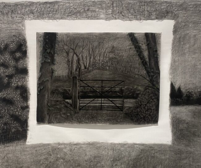 Elaine Somers-Cashen | Experiments in First View – Expanded Studio 2024 | Tuesday 23 January – Saturday 3 February 2024 | Garter Lane Arts Centre | Image: Elaine Somers-Cashen | pencil or charcoal drawing (or similar) ofa rural scene, though it is also of one scene inserted into what is another landscape – there a wide edge, like that on a frame, with some hints of a field, then white space a bit narrower than the frame, then a continuation of the frame scene or, more likely, a new scene which depicts a view towards a farm-style gate (which is possibly not very effective – there’s a big gap to one side before it meets what may be a stone wall; across a narrow road we see a wall or hedge, then a field which seems to be triangular and perhaps rising; it is bounded by wintry trees, and there is a hint of a church’s steeple at the top 
