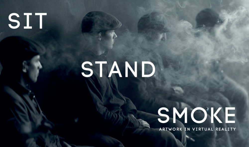Curtin and Keating: Sit Stand Smoke (Hero), 2023 © the artists | CURTIN // KEATING: Sit Stand Smoke | Friday 26 April – Sunday 5 May 2024 | Crawford Art Gallery | Image: Curtin and Keating: Sit Stand Smoke (Hero), 2023 © the artists | black-and-white, landscape-format photo or video still; four figures in a smoke-filled environment; they are sitting, probably on a bench, arranged from left to right and all apparently looking towards their left; each is short-haired and wearing a flat cap 
