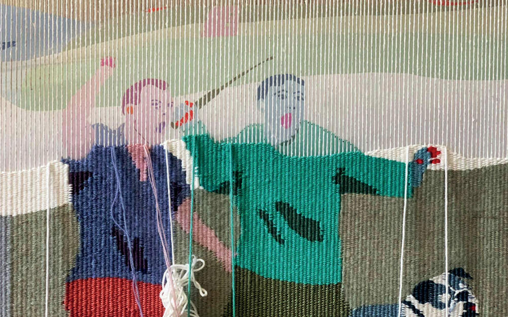 Ursula Burke Work in Progress (2023) © the artist | Ursula Burke: These Fragile Monuments | Saturday 25 May – Sunday 21 July 2024 | Crawford Art Gallery | Image: An in-progress tapestry; we see two figures apparently shouting while gesticulating – right arms raised, one holding what seems to be an electronic device, possibly a form of taser?; the bottom half of the tapestry appears to have its final layer already, but the top is more faded, apparently lacking a layer 