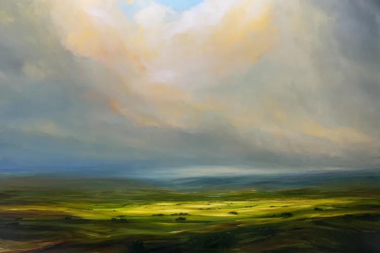 Harry Brioche: Radiant Rays, Oil on Board, 101.6 x 152.4cm | Harry Brioche: Emerald Dreams | Saturday 6 July – Wednesday 24 July 2024 | Gormleys Fine Art, Dublin | Image: Harry Brioche: Radiant Rays, Oil on Board, 101.6 x 152.4cm | view out over an undulating plain; the land is mostly various shades of freen, with some hint of boggier (brown) land; most of the land is under the shadow of clouds, but a central area is more brightly illuminated; high clouds tinged with orange rise above the land 