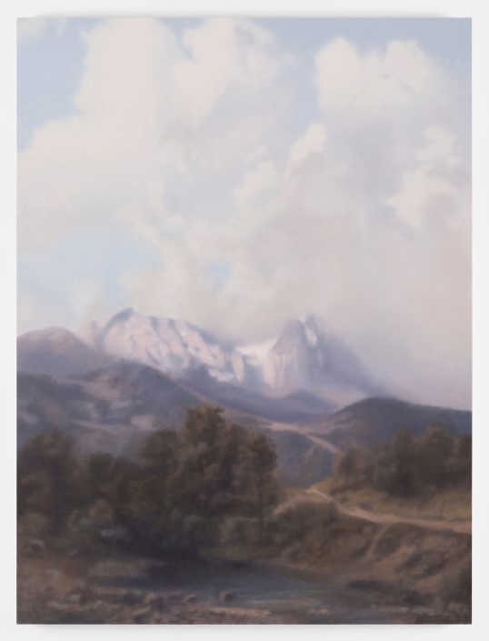 Paul Winstanley: Landscape with Clouds II, 2024, oil on panel, 56 x 42 cm / 22 x 16.5 in | Paul Winstanley: Arcadia | Friday 29 November 2024 – Saturday 18 January 2025 | Kerlin Gallery | Image: Paul Winstanley: Landscape with Clouds II, 2024, oil on panel, 56 x 42 cm / 22 x 16.5 in | painting of a fairly idyllic scene – tame wilderness with a small lake / pond in the foreground, trees behind it, a road / path on the right leading into the distance, upwards, to the foothills of a snowy mountain; pretty clouds rising high in the background, with pale sky behind; all fairly fuzzy or blurry, dreamlike 