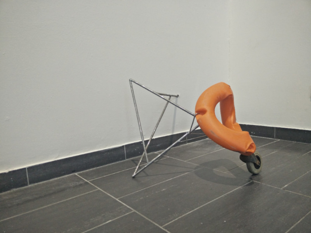 Laura Ní Fhlaibhín: circling the parameters and not passing to that time, lifebuoy, metal bar, caster wheel, 2015 | Laura Ní Fhlaibhín: Lamellae | Friday 20 November 2015  – Saturday 16 January 2016 | The LAB