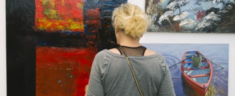 Enjoying work at the opening of the 2015 Members Exhibition. Photo by Emma sq