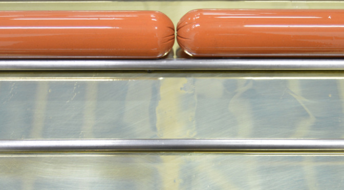 From Here to Eternity single screen moving image, looped (steel hot dogs with oil on brass), 2014 | Jemma Egan | Sheila Rennick: Sausage Fest | Friday 28 October  – Friday 18 November 2016 | ArtBox