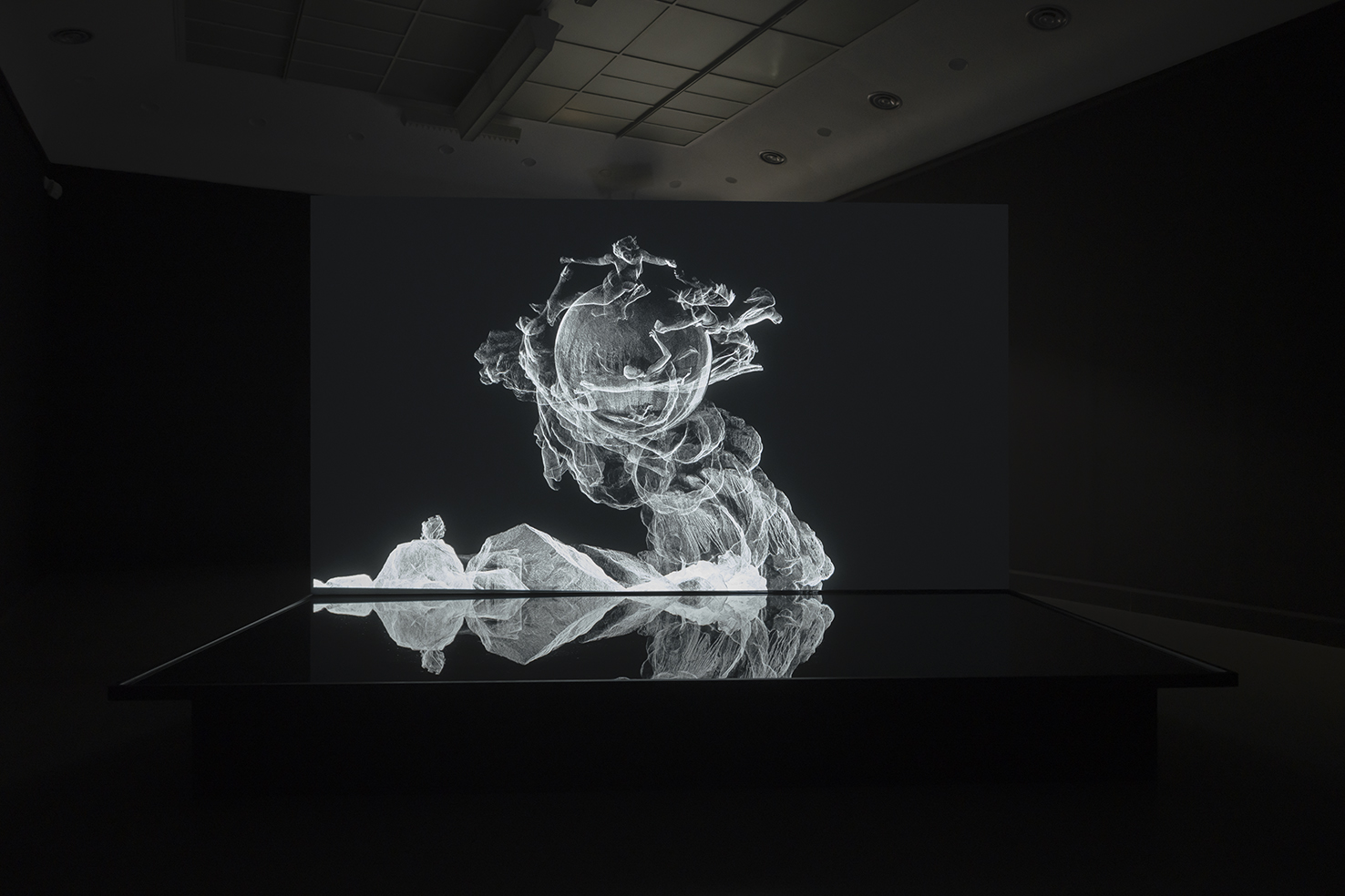 The Otolith Group, Sovereign Sisters, 2014. computer animation transferred to HD video 16:9, and water installation (black and white, no sound) duration 3 min 47 sec. Courtesy of The Otolith Group and LUX, London. Installation view 2019. Archive Van Abbemuseum Eindhoven. Photo: Peter Cox. | The Otolith Group: Xenogenesis | Thursday 7 July 2022  – Sunday 12 February 2023 | IMMA