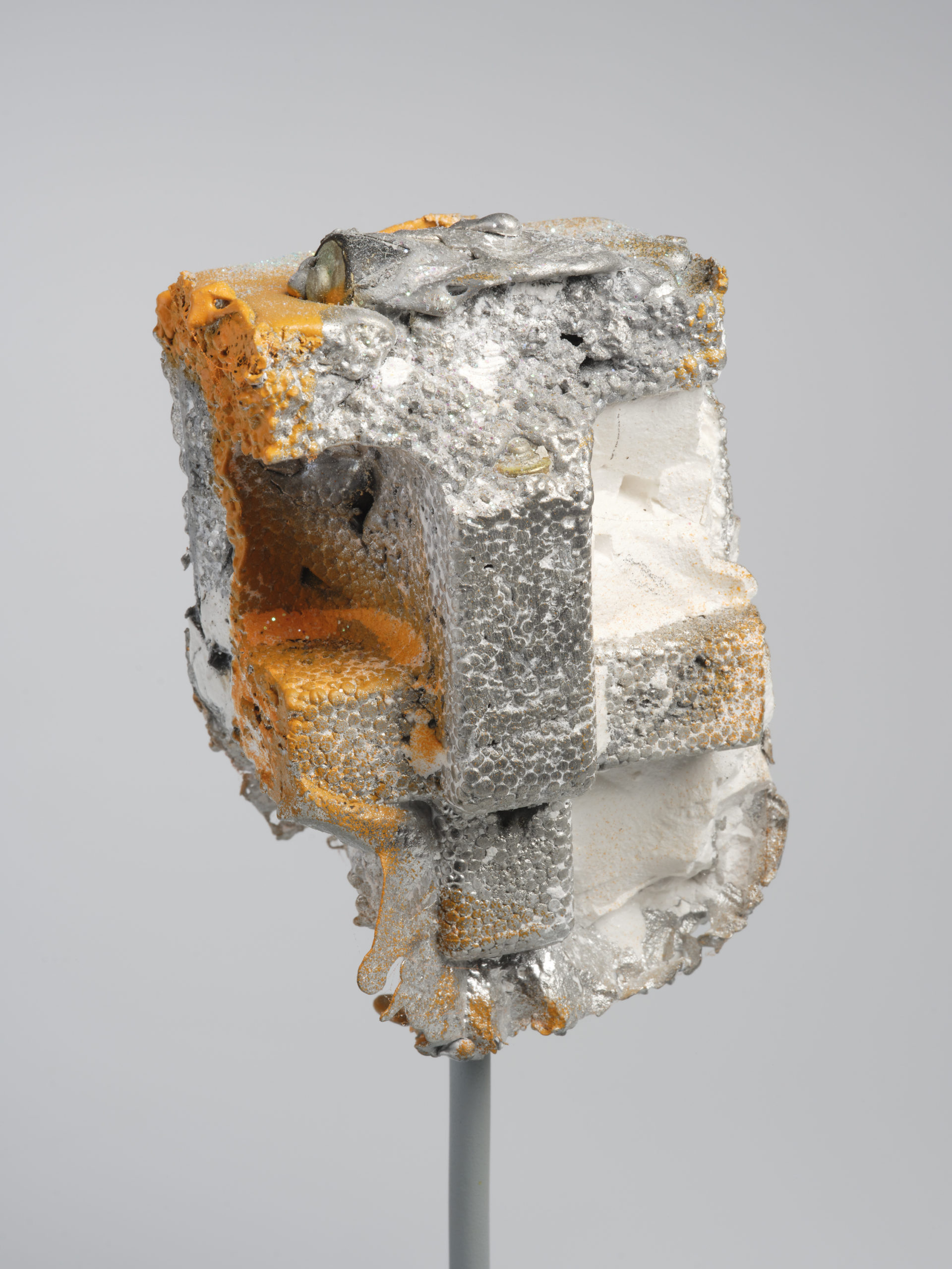 Brendan Earley, Head (feeling knackered), 2020, pewter, spent batteries, plaster, paint , glitter and steel, 22 x 21 x 19cm; image courtesy of the artist | Brendan Earley: Spent | Friday 18 November 2022  – Sunday 29 January 2023 | Royal Hibernian Academy