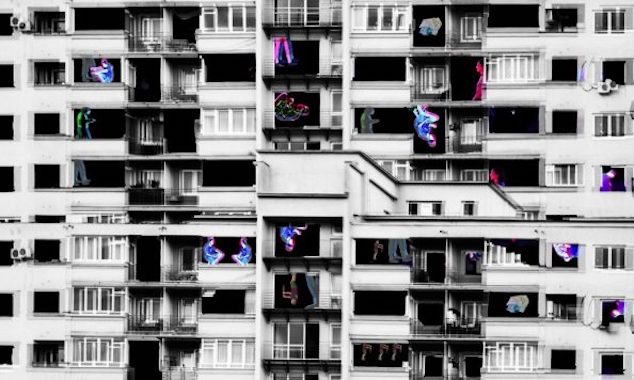 Homeland: Through Light and Shade | Friday 10 March  – Saturday 22 April 2023 | The Source Arts Centre | Image: black-and-white photo of what looks like a modern apartment block; magenta, purple and blue-coloured shapes, possibly representing people, are superimposed in window and balcony spaces 