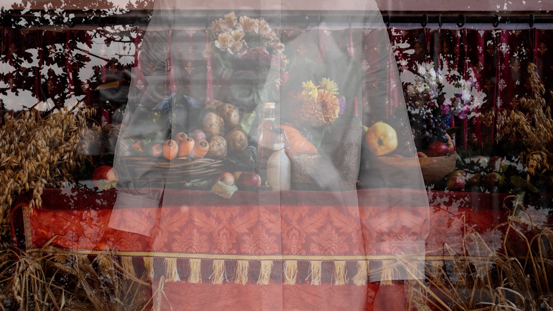 Debbie Godsell: Flail | Thursday 16 February  – Thursday 6 April 2023 |  | Photographic image, of what looks like a triple exposure of a waiter superimposed over a table with abundant vegetables, fruit and flowers 