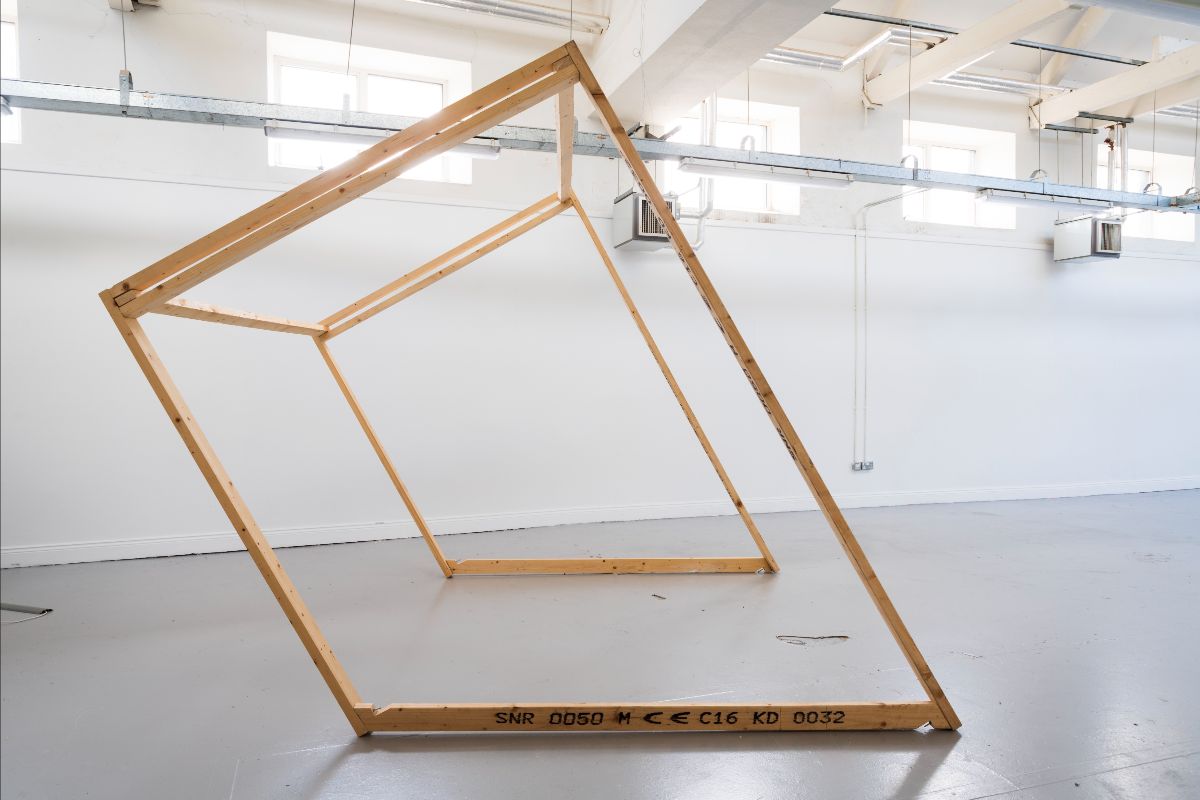 Ailbhe Wakefield Drohan, TUS LSAD | NSF Graduate Presentation Night | Wednesday 19 April 2023  | Crane Lane Theatre | Image is of an artwork by Ailbhe Wakefield Drohan of TUS LSAD – what appears to be a large, fragile wooden structure, about the size and shape of a soccer goal, but turned upside-down (and without the net) 