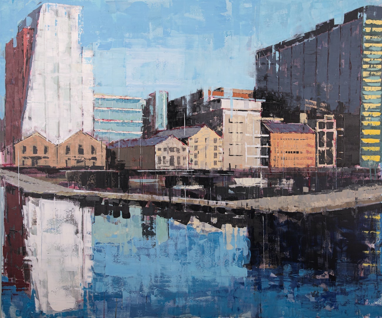 Bridget Flinn: Not Far from Here | Thursday 1 June  – Saturday 24 June 2023 | Solomon Fine Art | Image: painting, colourful, fairly rectilinear and with what looks like a fair amount of impasto, of buildings at Grand Canal Dock, Dublin 