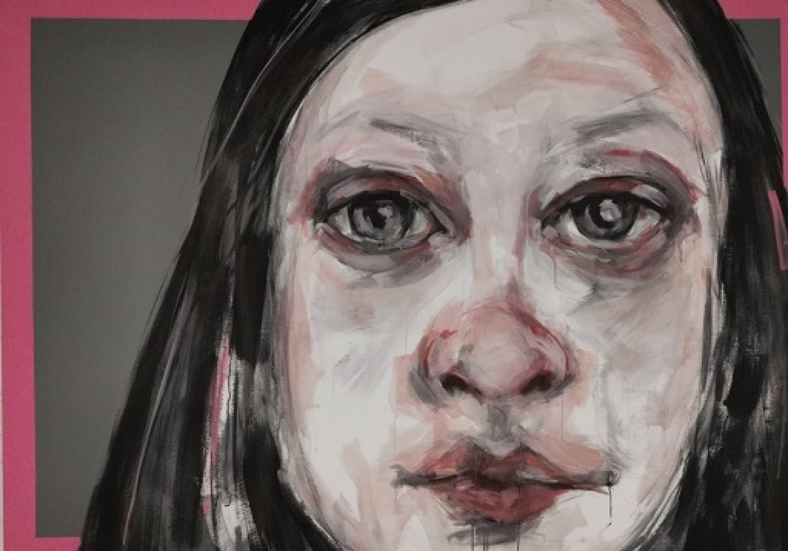 Bernadette Doolan: I'll Find my Way, acrylic, 195 x 155cm, 2022 | Bernadette Doolan: Transference, How you see me is how you see yourself | Friday 2 June  – Saturday 1 July 2023 | The Source Arts Centre | Image: Bernadette Doolan: I'll Find my Way, acrylic, 195 x 155cm, 2022 – close-up of a girl's face, cropped mid-forehead and mid-chin; pale, with charcoal-colour and pale-ish pinks against black hair; there's a partially occluded painted pink frame around a flat grey background 