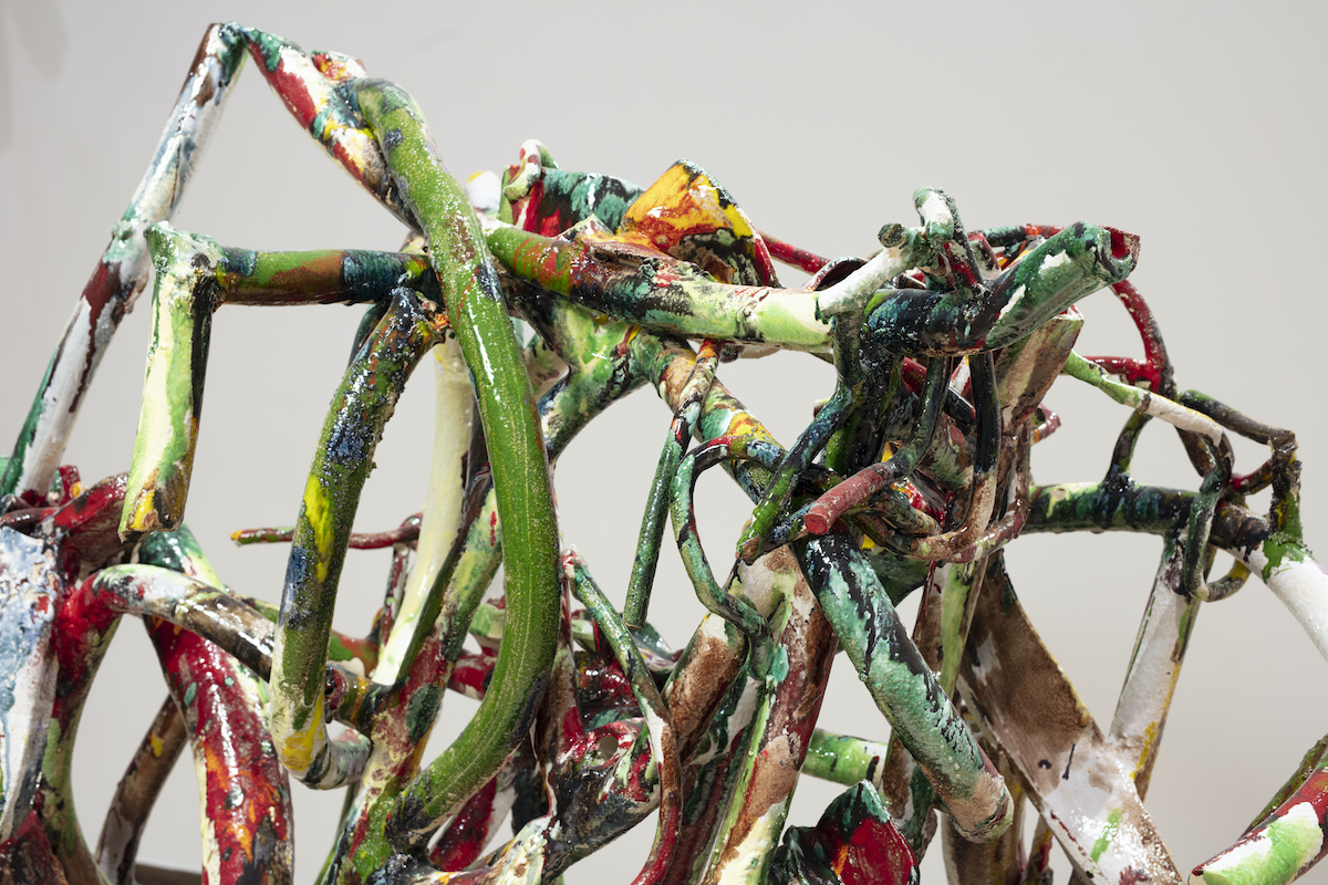 Linda Sormin (US) | CLAY: holding / transforming / performing | Saturday 15 July  – Friday 25 August 2023 (two weekends) | National Sculpture Factory | Image: artwork by Linda Sormin (US) – a photo of intertwined, coiled, bent tubes decorated with splodges of paint in saturated colours 