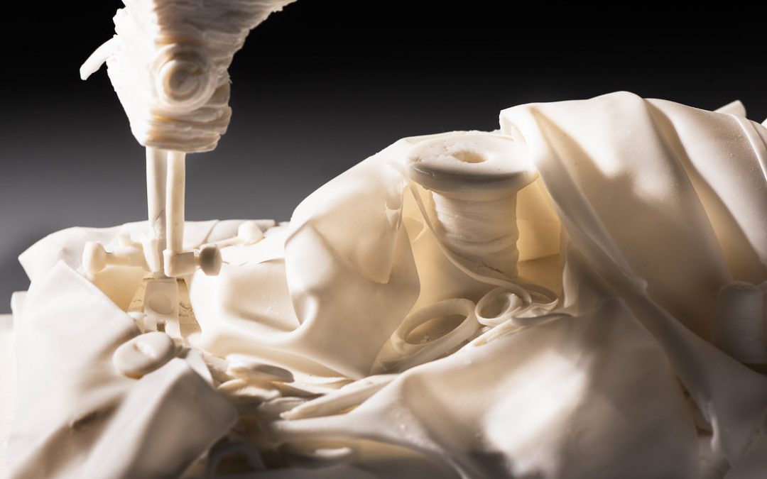 Anne Butler: Objects in Time | Thursday 3 August  – Saturday 2 September 2023 | Golden Thread Gallery | Image: close-up photo of pale cloth and part of a pale sewing machine (?) plus pale scissors and pale spool of thread 