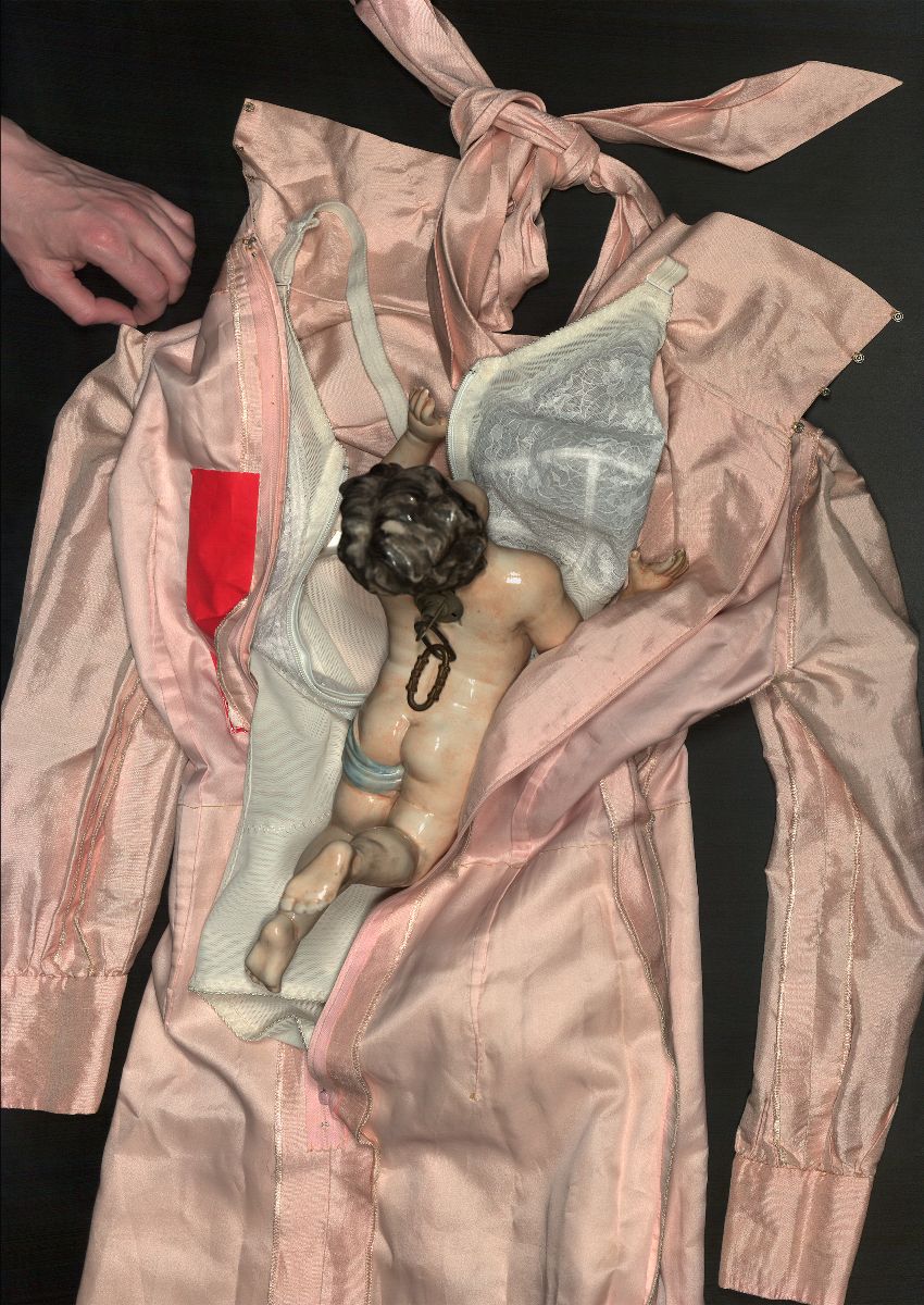 Joanne Hynes, detail from in that empty space, the very all of it (diptych), scanned collected garments and objects, digital print on archival paper, 2023 | Joanne Hynes: what we carry with us | Thursday 20 July  – Saturday 5 August 2023 | Kevin Kavanagh | Image: Joanne Hynes, detail from in that empty space, the very all of it (diptych), scanned collected garments and objects, digital print on archival paper, 2023 – black background with what may be a raincoat, pink, spread on it, maybe a bra on the coat, ceramic statue of a putto (? – no wings), hand coming in from top left pulling lightly at the shoulder of the coat 