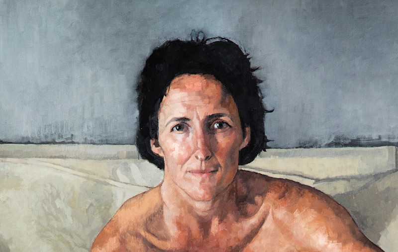 Victoria Russell, Portrait of Fiona Shaw (detail), 2002. © the artist | All Eyes on Us | Saturday 18 November 2023  – Sunday 24 March 2024 | Crawford Art Gallery | Image: Victoria Russell, Portrait of Fiona Shaw (detail), 2002. © the artist | head and bare-shoulders cropped painting of the actor looking straight at us; realistic, though the hair colour is pushed to jet black and colours are otherwise somewhat flattened; the background is bisected vertically behind the actor’s head; the top half is an uneven grey (uneven in part because of visible paint strokes), the lower area creamy white; the bisecting line is, à la Cezanne, not consistent – left and right parts are slightly but clearly out of whack 