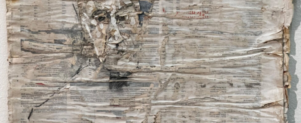 Flaky-self-portrait-with-hat-on-Financial-Times-Beth-Royds-2022-Newsprint-gesso-graphite-glue