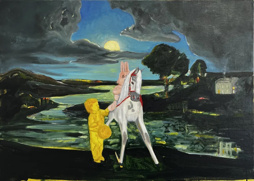 Serena Caulfield: Of Silver and Gold, oil on canvas, 50 x 70cm | Serena Caulfield: Dream Baby Dream | Thursday 11 January  – Saturday 3 February 2024 | Solomon Fine Art | Image: Serena Caulfield: Of Silver and Gold, oil on canvas, 50 x 70cm | allegorical scene with a tall white rocking horse viewed almost head-on; a pink rabbit with up-pointing ears appears to be sitting on it; a child, draw in orange on a bright yellow background, is reaching up, possibly holding the rabbit’s right foot; behind we see a rural landscape with trees, sea or lake and hills; a yellowish moon (?) is peeking from behind grey clouds, one of which seems to be hiding the face of a shocked ghost 