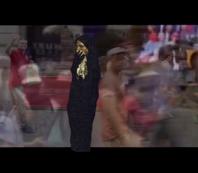 Brigid McLeer, The Regent Street, 2019.  Video still detail | Brigid McLeer: Cosmus | Friday 16 February  – Sunday 7 April 2024 | Limerick City Gallery | Image: Brigid McLeer, The Regent Street, 2019.  Video still detail | the image has black horizontal bands at top and bottom, something you often see with video clip; between the bands the images is a photo fo a street scene, with motion blur for many of the pedestrians; superimposed is what may bw a computer-generated image of a figure with a golden face, long black hair, long black clothing, a black arm and hand olding a white-ish cloth to nose and mouth, concerned look on face, with left eye looking towards us although the body and head are largely turned to the right 