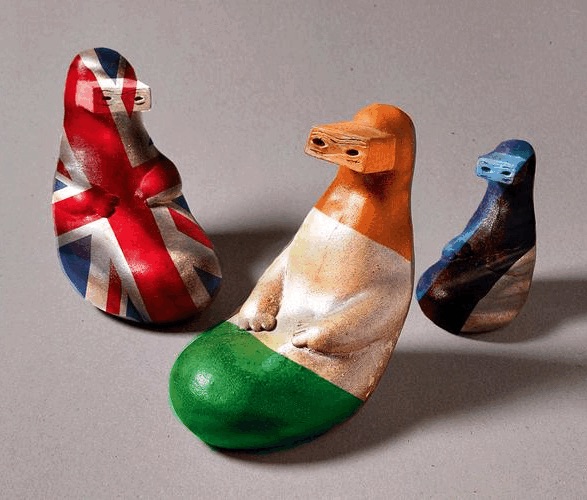 Edges | Tuesday 20 February  – Thursday 21 March 2024 | Wexford Arts Centre | Image: photo of three ceramic animals against a grey background, lit from the left; the critters are seal-like, sitting somewhat awkwardly – leaning back but with no support; each ‘seal’ is wearing what looks like a boxy VR set; each seal is also decorated by the colours of a country flag – from left to right: UK, Ireland, Estonia 