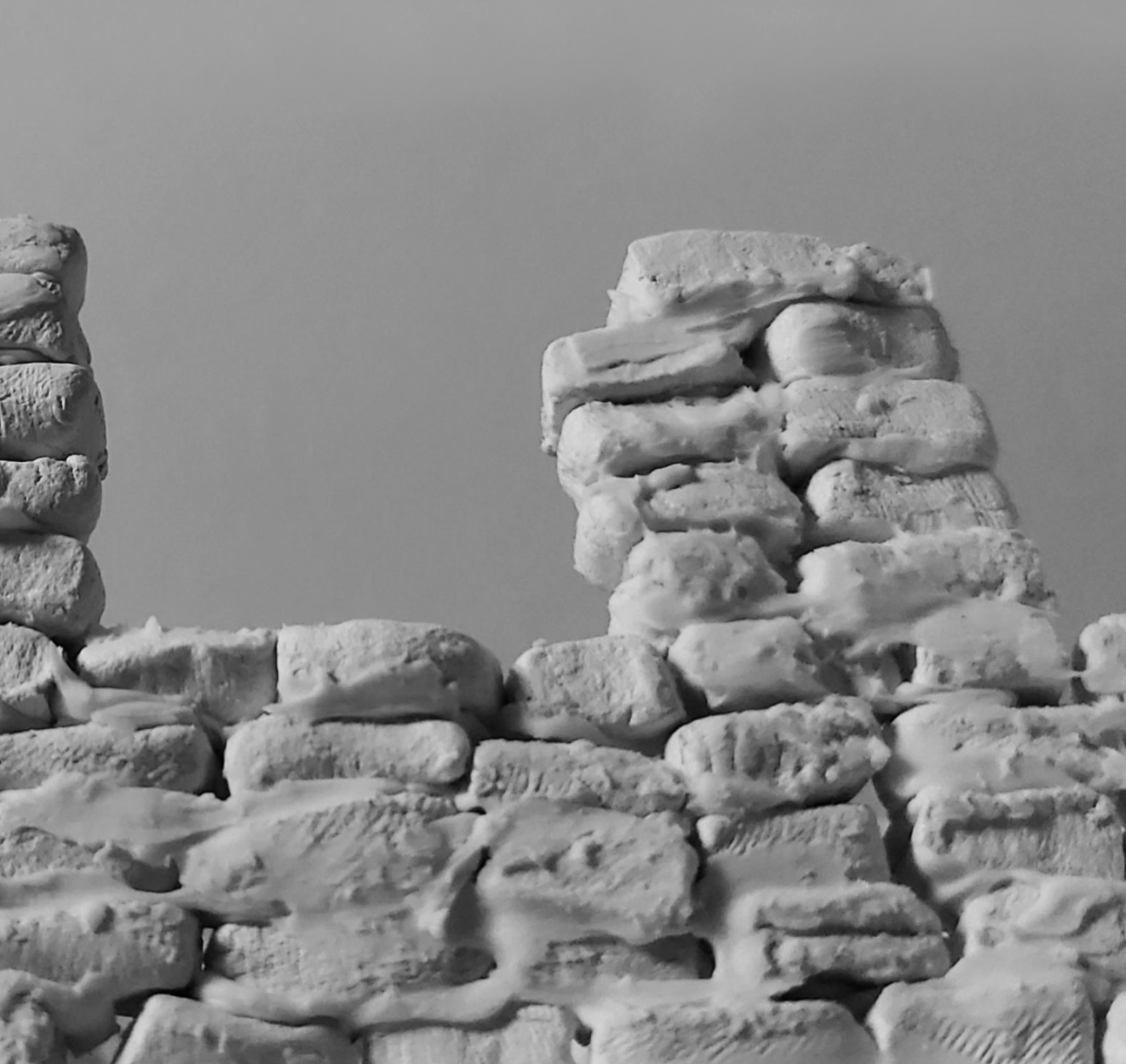 Christine Kernohan: Empty House | Tuesday 4 June  – Wednesday 24 July 2024 | Atypical Gallery | Image: greyscale photo of a broken, rough-brick wall