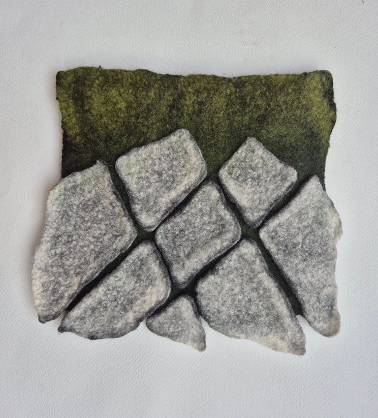 Annika Berglund: Tapestry | Sunday 17 November  – Sunday 15 December 2024 | Olivier Cornet Gallery | Image: the work is quite likely made of wool; it could be interpreted as a view from above of stone, mosaic-like, intruding onto grass; the ‘stones’ are ’on’ the grass, in the sense that they through shadows onto it, and create dark shadows in the gryke-like gaps between themselves; the grass is short – woollen 