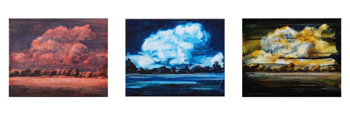 Image: Beth Royds: Flaky self portrait with hat on Financial Times, 2022, newsprint, gesso, graphite, glue | SURVEYOR 2024 | Saturday 16 November  – Saturday 21 December 2024 | Solstice Arts Centre | Image: apparently three painted views of the same landscape – grassy field, row of trees at its edge in the distance straight ahead, large cloud above and behind, possibly above low hills; each of the three has a different overriding color scheme; the one the left is very reddish, the middle one very blue-ish, the one on the right leaning into yellow ochre 