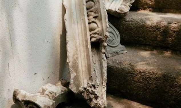 Valerie Mulvin: The Reason of Towns | Saturday 11 January  – Friday 7 February 2025 | The Source Arts Centre | Image: photo of some old architectural discards leaning against a wall at the foot of some worn stone stairs; dappled light 