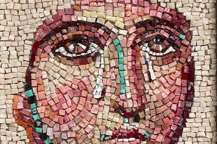 Ursula Burke, Weeping Portrait, 2022 (Detail), © The Artist | Ursula Burke: Siren | Saturday 22 February  – Sunday 27 April 2025 | Butler Gallery | Image: Ursula Burke, Weeping Portrait, 2022 (Detail), © The Artist | we see part of a face made using mosaic in Greco-Roman style; just mouth, nose, eyes and one ear; the eyes are brown and slightly raised to heave; this person does not seem too happy 