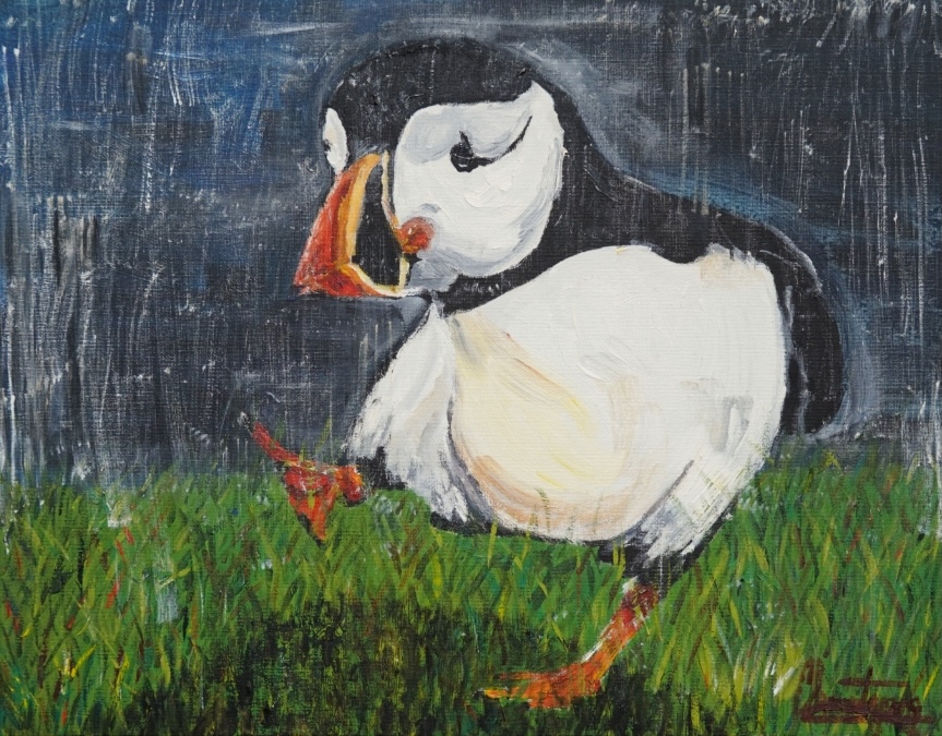 Clement Yang: Puffin, 2024, acrylic on canvas, 54 x 45cm; courtesy Connections Arts Centre | CA Collective at the RHA 2025 | Friday 14 March  – Sunday 20 April 2025 | Royal Hibernian Academy | Image: Clement Yang: Puffin, 2024, acrylic on canvas, 54 x 45cm; courtesy Connections Arts Centre | painting of a puffin walking on grass, confidently, one foot in the air, the other on the grass; the background is greyish blue, streaked with pale white; the puffin casts a shadow 