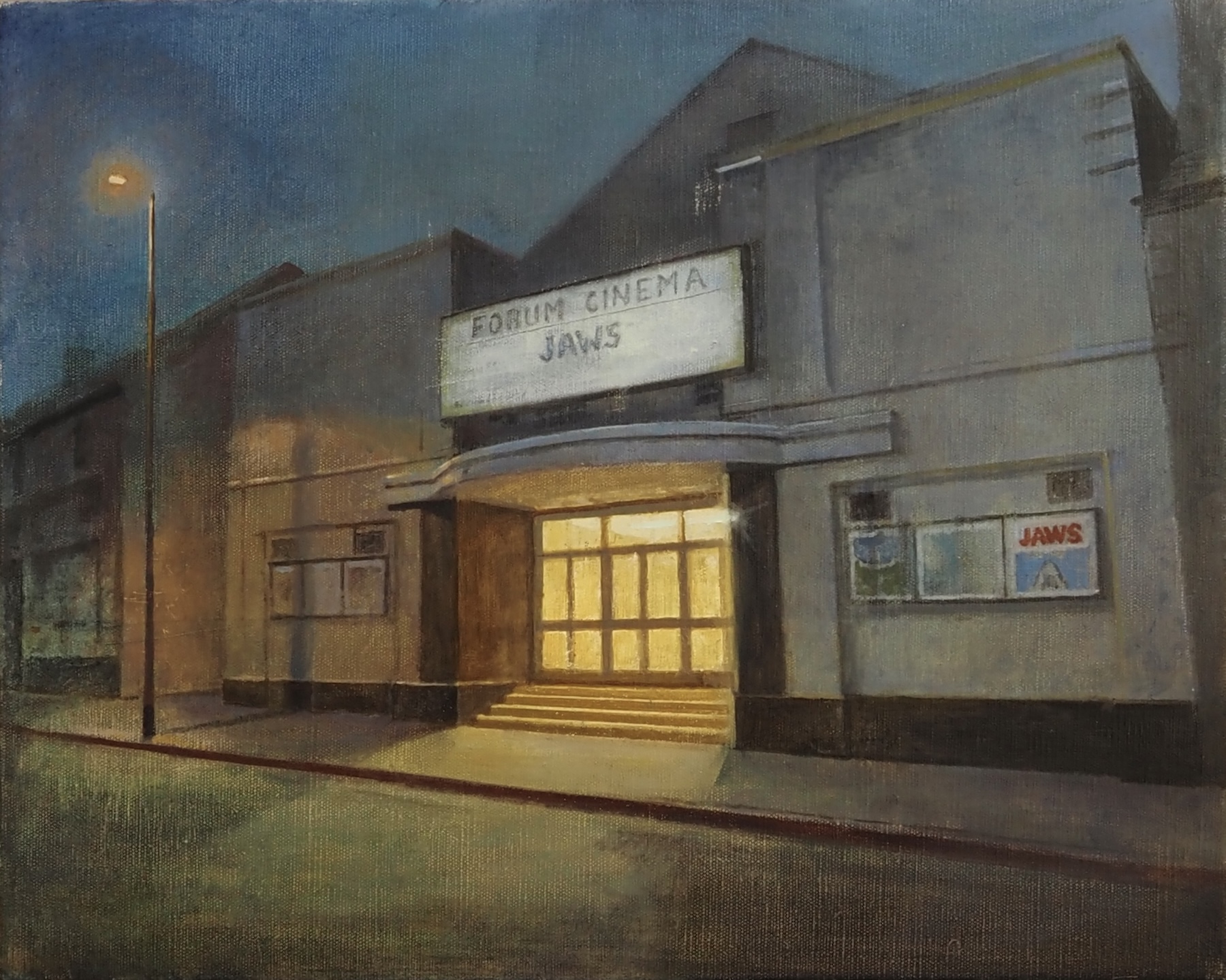 Maeve McCarthy: Returning / Heritage | Saturday 5 July  – Wednesday 3 September 2025 | Municipal Gallery | Image: looks very much like oil on canvas; 'Forum Cinema' is depicted at twilight, on an empty street, with light spilling from the interior foyer out down the cinema steps onto the street; there is also a single, lit street lamp; we know that the year is 1975, as ‘Jaws’ is the film  on offer – there is a corresponding poster on a smallish display board on the wall of the cinema 