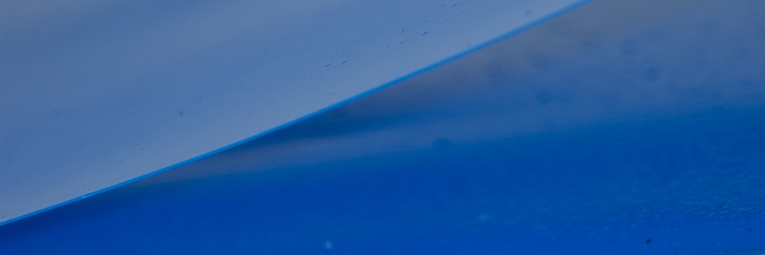 Ciarraí MacCormac: Dura | Saturday 4 October  – Saturday 20 December 2025 | CCA | Image: it is hard to be sure exactly what is being show, but it is possibly a skein of very blue paint; the image is more or less bisected from top right to bottom left, with paler blue above and darker blue below; there is a lot of surface sheen 