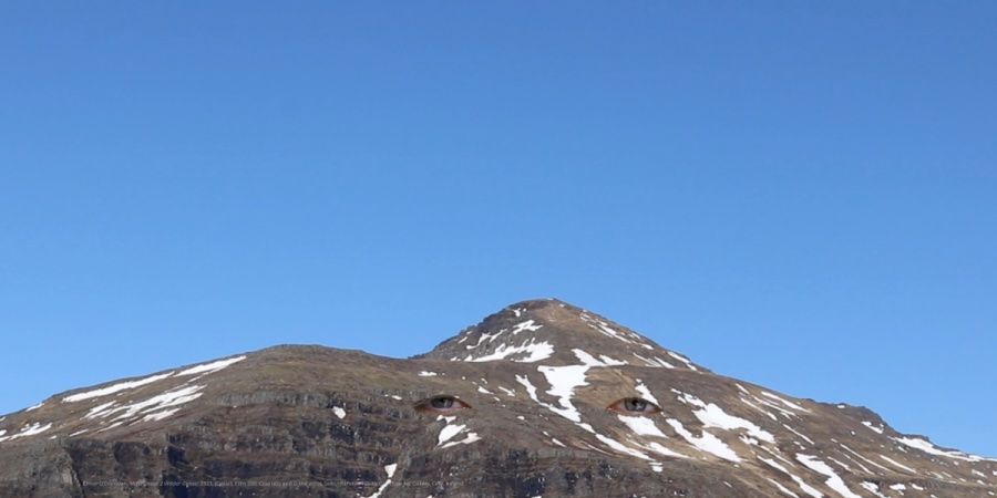 Elinor O’Donovan, 'Wild Geese 2 Wilder Geese', 2023. Film Still. Courtesy and © the artist. Selected for AFI’25 by Crawford Art Gallery, Cork, Ireland. | Artists’ Film International 2025 | Monday 6, 13 and 20 October 2025  |  | Image: Elinor O’Donovan, 'Wild Geese 2 Wilder Geese', 2023. Film Still. Courtesy and © the artist. Selected for AFI’25 by Crawford Art Gallery, Cork, Ireland  | we see a mountain, probably not very high, viewed from lower ground; the sides are mostly bare and brown, though there are patches of snow; the sky is uninterrupted blue  