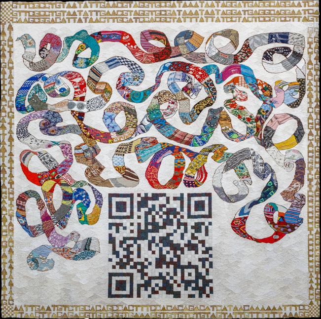 Photo Credit: Anthony Hobbs | Cut From The Same Cloth | Friday 14 November  – Saturday 20 December 2025 | Roscommon Arts Centre | Image: Photo Credit: Anthony Hobbs |  a photo, it seems at least, of a square quilt; the background is white, textured; there is a golden border, which is made up of some letters and some other symbols, mostly A, somewhat funkily, T, C and G – so DNA; there is a swirl of very various textile patterns in a band that looks like a very very long tie that someone might wear; below this swirl is a QR code; if you scan it with your phone, it takes you to cutfromthesamecloth.org, which is fabulous!! The UCD Patient Voice initiative is part of the Conway Institute, they support this project and are at patientvoice@ucd.ie 