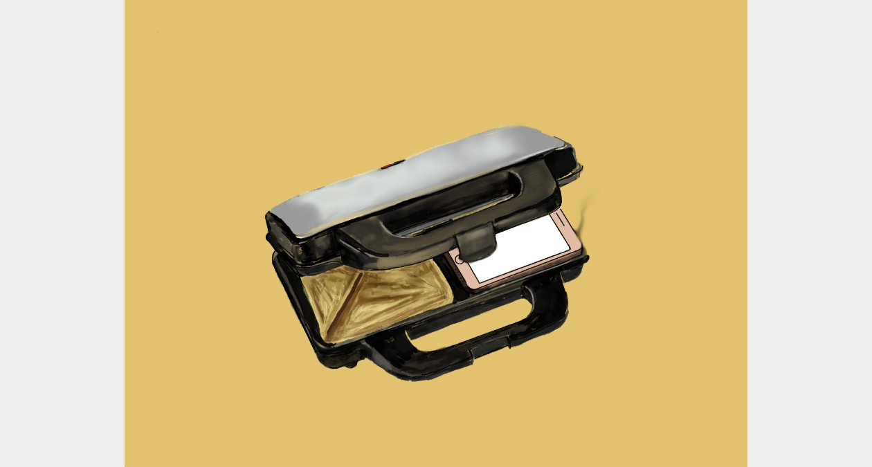 Aideen Barry: Monachopsis Drawing 3; courtesy of the artist | Key Learnings from Cross-Market Synergetic Alignment | Friday 13 February  – Sunday 19 April 2026 | Royal Hibernian Academy | Image: Aideen Barry: Monachopsis Drawing 3; courtesy of the artist | the caption says ‘drawing’ but it looks like a photo of a toastie-makrer against a very uniform yellow-ochre background; the toaster is somewhat open, and one one side of the two-sandwich device we see a mobile phone awaiting its fate 