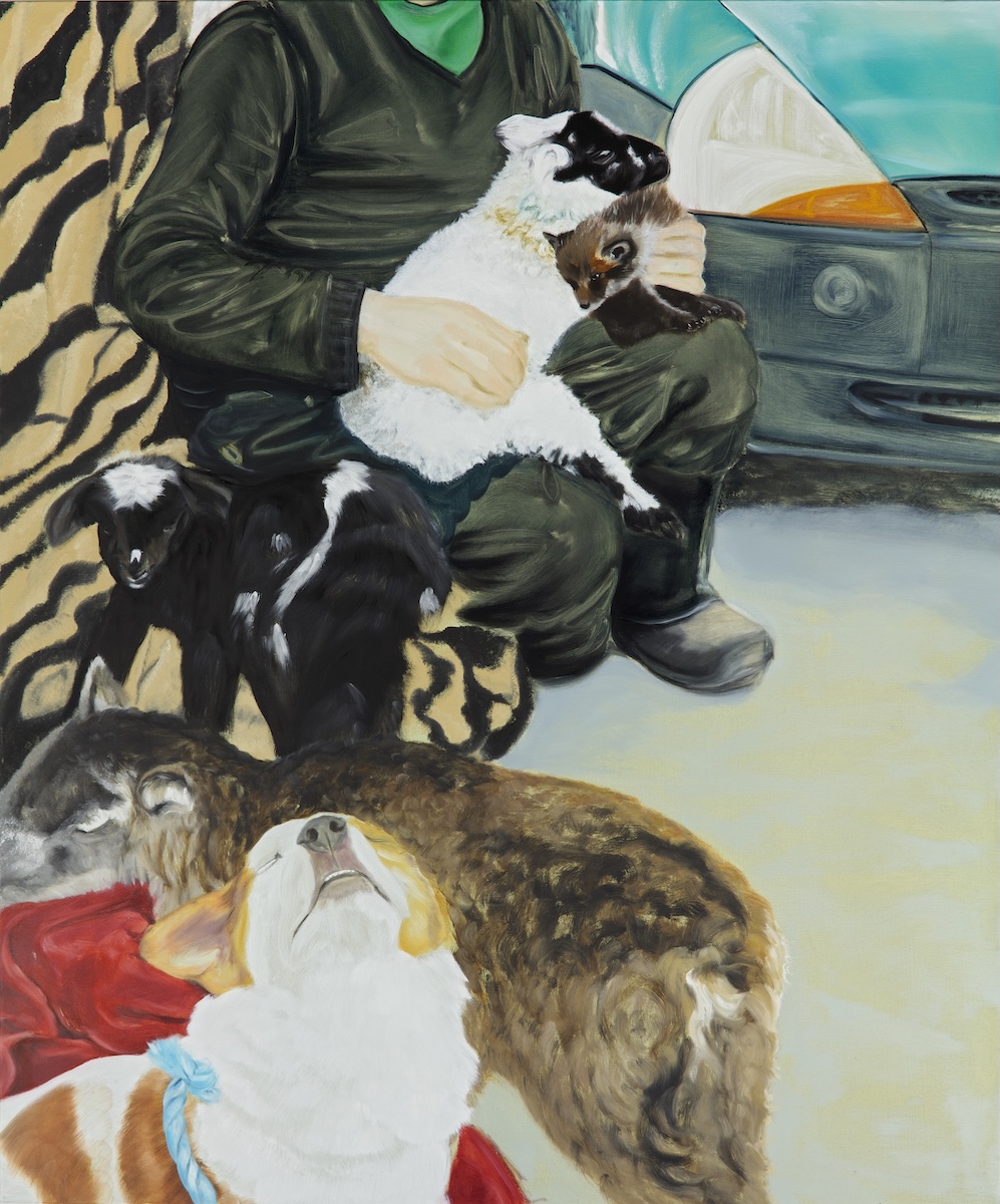 Bennie Reilly, Emotional Support, oil on canvas, 120 x 100cm, 2025; photo Davey Moor | Bennie Reilly: Follow your Dream | Sunday 1 March  – Wednesday 29 April 2026 | Municipal Gallery | Bennie Reilly, Emotional Support, oil on canvas, 120 x 100cm, 2025; photo Davey Moor |  we see the body but not head of someone in work overalls or similar, plus wellies or similar; the figure is seated and holding a black-faced white lamb and what may be a fox cub or similar; behind the figure and at the left edge of the canvas is a tiger-skin-patterned fabric while behind to the right is perhaps a trailer and perhaps an Irish flag;  left front is a white-and-yellow-orange dog lifting its nose towards us though with closed eyes; behind it is a grubby-looking sheep, then a black-and-white lamb; it’s complicatedThis exhibition of paintings and mixed-media sculptures by Bennie Reilly draws on her interest in museum collections, natural history, and her own interactions with the natural world. Her paintings stem from an ever growing archive of personal photographs, while her sculptural works combine bric-à-brac and natural artefacts collected over many years. Together, these artworks…”