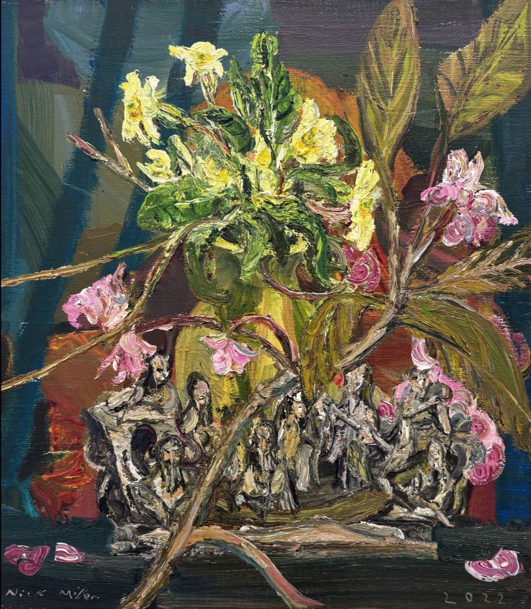Nick Miller, Doubtless plum or cherry-branch, oil on canvas, 46 x 41 cm | Summer Group Exhibition | Thursday 11 June  – Saturday 4 July 2026 | Taylor Galleries | Nick Miller, Doubtless plum or cherry-branch, oil on canvas, 46 x 41 cm | somewhat straightfoward painting of a still life, though there may be two vases competing with each other, one holding a primrose (so it may not be a vase…), the other hard to say, and a branch of the eponymous plum or cherry is just settled across this scene, which also seems to include figurines, vaguely like toy soldiers; strong coloration 