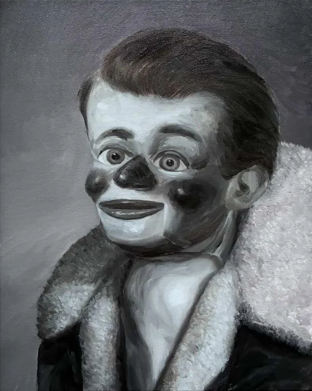 Patrick Redmond, 'Dummy 3', oil on linen, 25 x 20cm | Patrick Redmond: Facemaker | Friday 11 September  – Tuesday 27 October 2026 | Molesworth Gallery | Patrick Redmond, 'Dummy 3', oil on linen, 25 x 20cm | greyscale painting of a figure in a fur coat; the figure looks like a ventriloquist's dummy – young, neat, plastic, red nose and red cheeks (if the painting were in colour), somewhat wonky eyes; we are viewing somewhat from the side, seeing more of the left cheek; but it is looking straight at or through us 